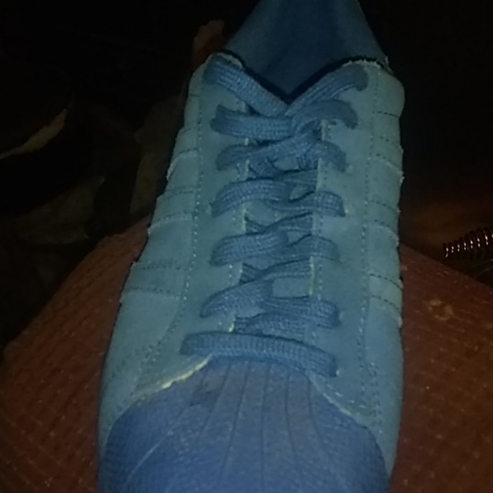 Solid blue shell toe Adidas superstars
